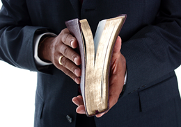 Pastor_Holding_Bible_Hero